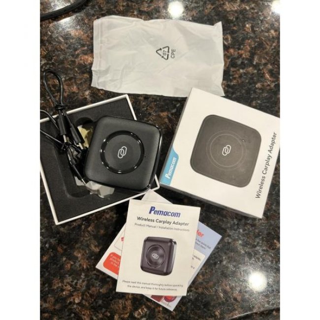 Wireless carplay adapter by pemacom, neatly packaged with accessories, ideal for seamless device integration.